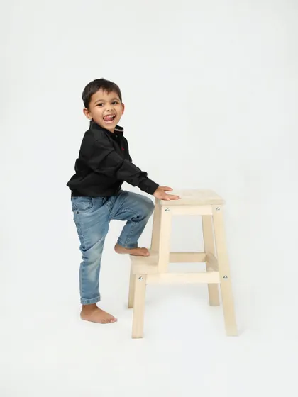 A happy little boy, full of smiles and energy. Simple, clean studio portraits like this are perfect for capturing a child's personality at any age.