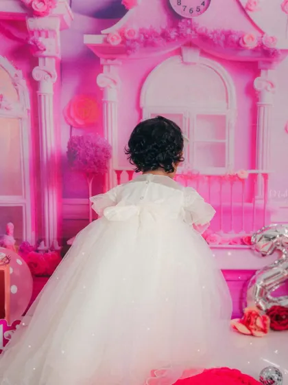 A lovely shot from the back, showing the beautiful details of her princess dress. Every angle is worth capturing.