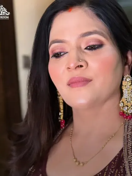 Another angle of the rosy look, highlighting the dewy skin and the soft, blended eyeshadow.