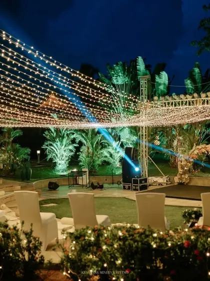 Lighting is key to creating atmosphere. For this Sangeet, we used a canopy of fairy lights and spotlights to transform an outdoor amphitheater into an iconic, concert-like venue for the night's celebrations.