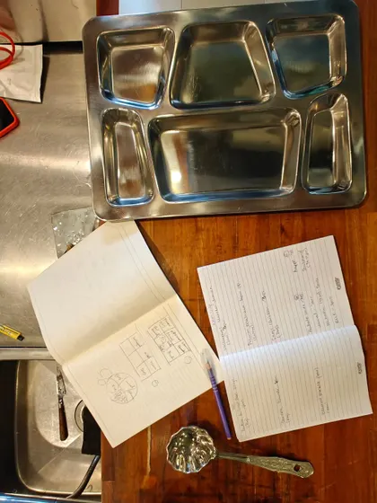 The planning stage. This is my handwritten menu and thali layout plan for the Maharashtrian meal experience in Japan.