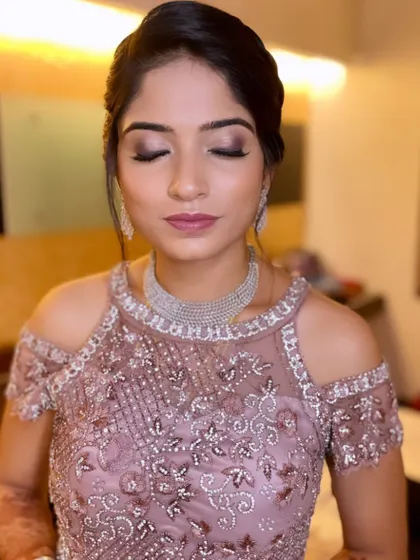 A close-up of Dr. Sunayana's eye makeup, showcasing the blended neutral tones perfect for an evening event.