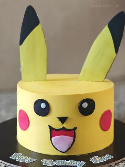 I choose you, Pikachu. This cute Pokemon cake is made with a butterscotch sponge and vanilla buttercream. The face, ears, and rosy cheeks are all crafted from fondant to create a cheerful and recognizable character.