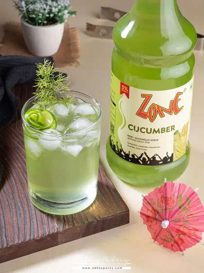 This shot for a cucumber syrup uses a cool, green color palette and fresh garnishes to communicate a sense of ultimate refreshment.