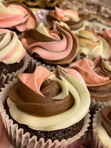 A close-up of my moist chocolate cupcakes with vanilla and chocolate swirl frosting, showing the beautiful ribbon effect of the buttercream.