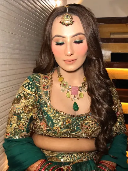 An eyes-closed shot showing the dual-toned eyeshadow.