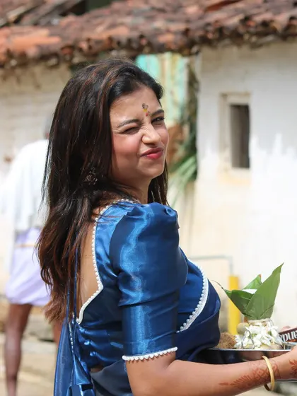 Sonu giving a playful look, enjoying the event in her comfortable and stylish custom outfit.