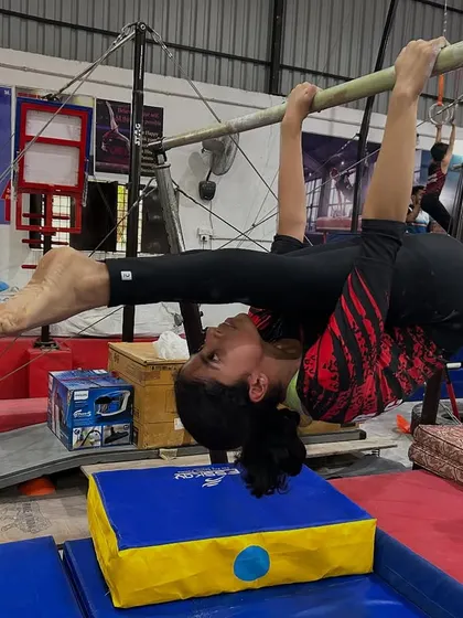 This skin-the-cat drill on the bar is excellent for building shoulder mobility and core strength. It's a foundational exercise we use to prepare for more advanced bar skills.