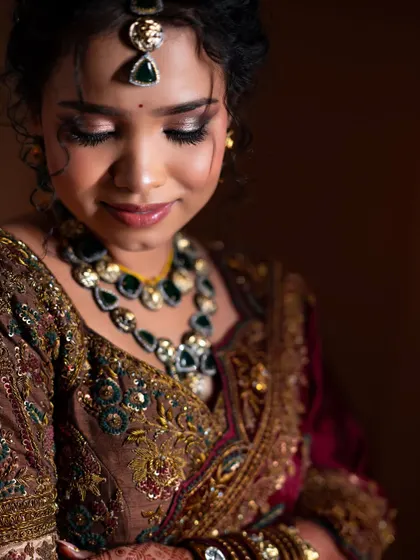 A close-up of Lavanya's eye makeup. The shimmering eyeshadow and defined lashes make her eyes the focal point of this stunning look.