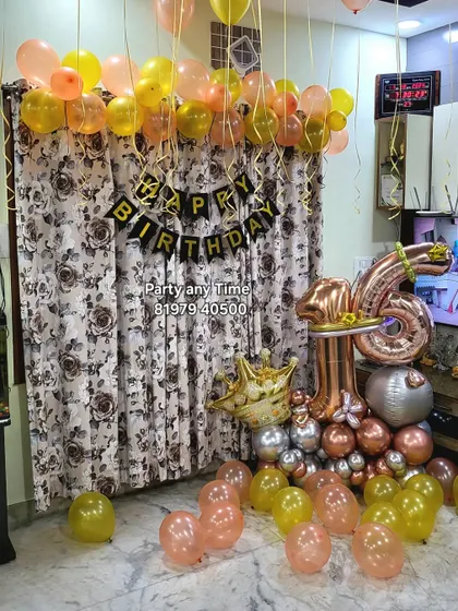 A 16th birthday home decoration showing a number bouquet and helium balloons. All items are available to buy or rent.