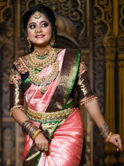A full-length view of the model, showcasing the grandeur of the jewellery and the beautiful saree.