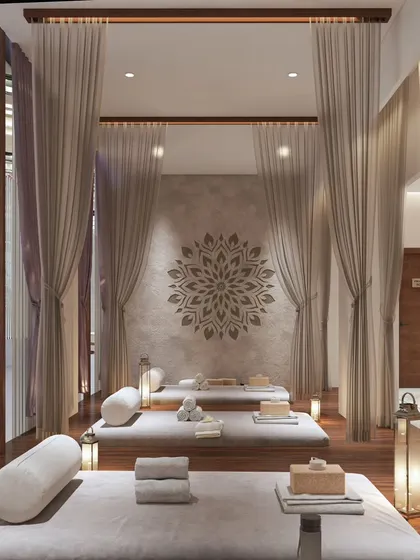 We design spaces that feel like a true escape. This spa lounge uses soft, flowing curtains and a calming color palette to create a sanctuary where guests can disconnect and rejuvenate.