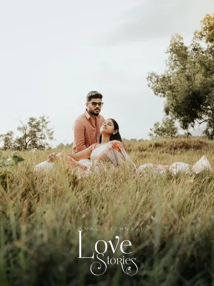 A beautiful portrait of a couple in a field, captioned "Love Stories."