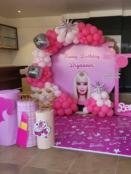 Another angle of the pink Barbie theme, showing the fun props like a giant lipstick and roller skate.