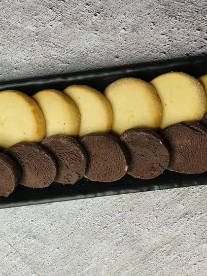 A tray of vanilla and chocolate shortbread cookies.