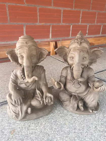 Every Ganesha idol is unique, just like the person who makes it. Here are a few different idols sitting side-by-side, each with its own personality and charm.