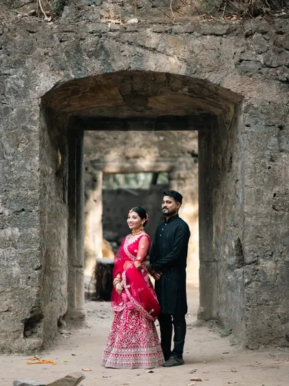 Another stunning shot of the couple framed by the fort's archway, showcasing the grandeur of the location for their pre-wedding shoot.
