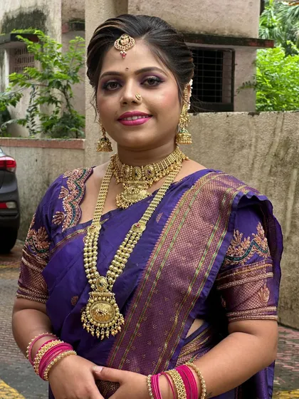 The model smiling for the camera, showcasing the complete traditional look.