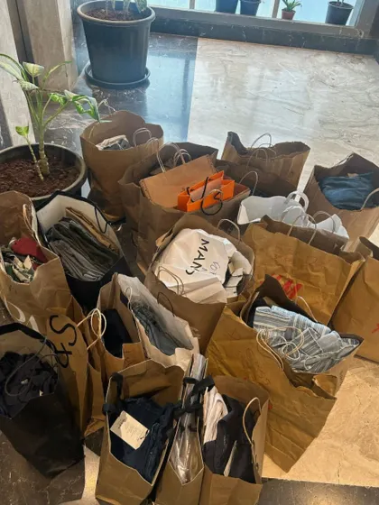 More behind the scenes chaos. Countless shopping bags filled with potential outfits and accessories waiting to be sorted and styled for a client.
