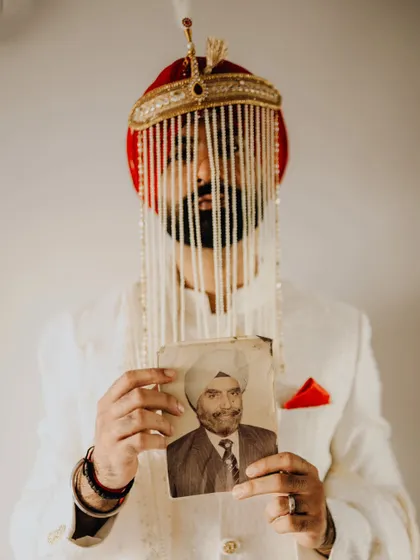 This was one of the most moving moments I've ever witnessed. The groom, Rahat, holding a portrait of his grandfather, connecting generations through a single, powerful image. It’s a reminder that weddings are about family, history, and the love that carries on.