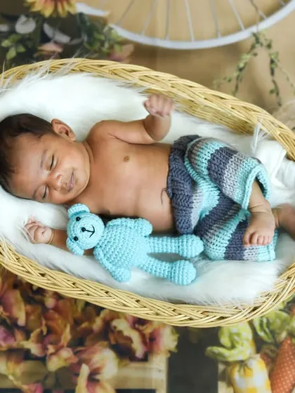 A sweet smile from a sleeping newborn. We patiently wait for these precious, fleeting expressions during our sessions.