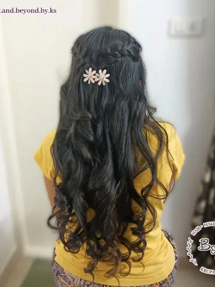 This half-updo is a perfect blend of detail and simplicity. I created a French braid at the crown and added soft curls through the lengths of her silky hair, giving it a gentle and feminine vibe.