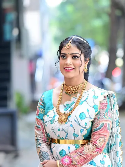 A lovely three-quarter shot of Preethi, capturing the grace and happiness of the occasion.