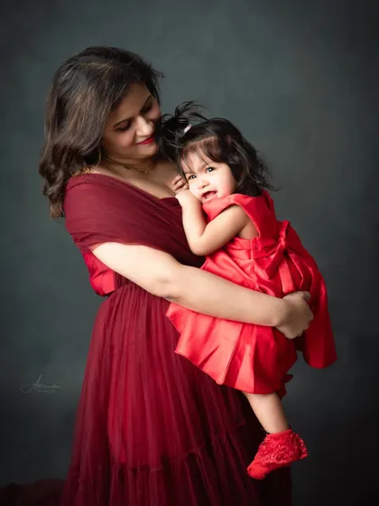 A mother comforts her child in a tender embrace. We capture the real, emotional moments of parenthood.