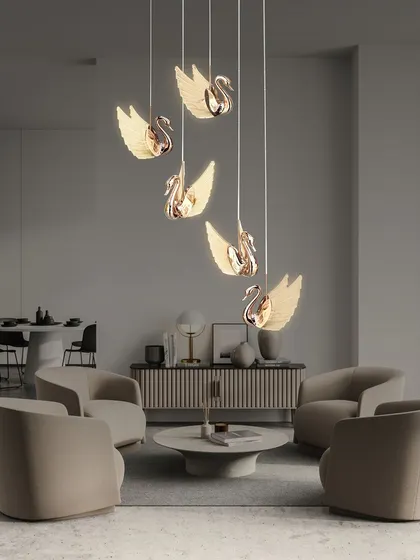 This elegant swan chandelier features a cascade of rose gold swans with glowing wings. It's a beautiful and graceful piece, perfect for a living room or a sophisticated bedroom.