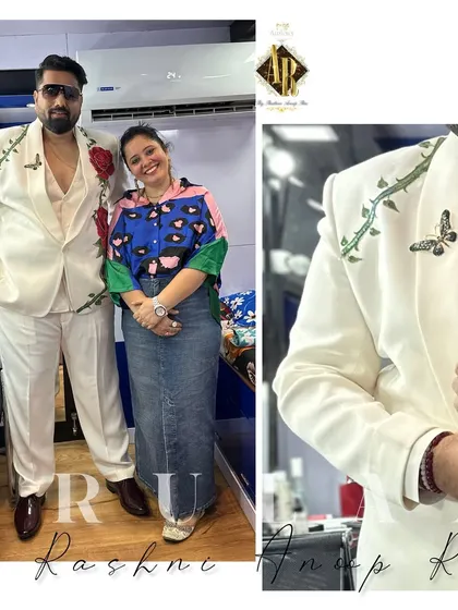 A closer look at the hand-painted white suit. The red roses symbolize love and romance, and we even added a small butterfly detail on the shoulder for an extra touch of artistry.