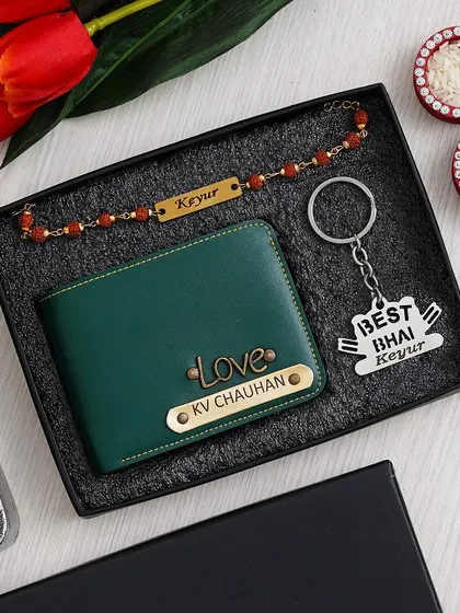The same "Must Gift" Rakhi combo, but with the wallet in a sophisticated green color and a "Love" charm.