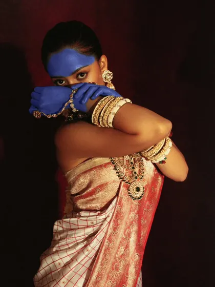 An artistic pose that combines traditional draping with modern, conceptual body art. This is for models looking to create a unique and memorable portfolio.