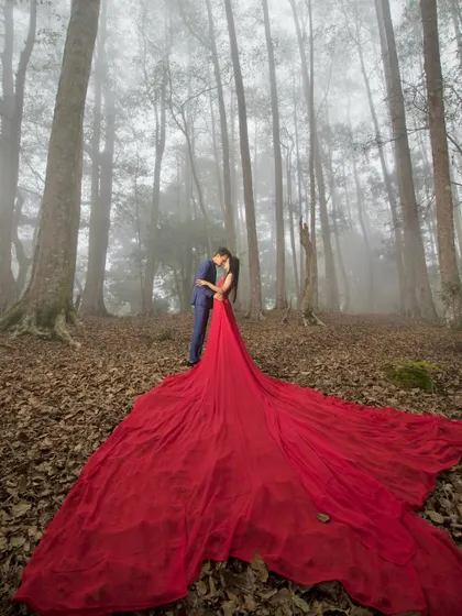 A fairytale moment captured in a misty Kodaikanal forest. I love creating these dramatic, cinematic shots, especially when couples are open to bold ideas like this flowing gown that adds a splash of color to the natural scenery.