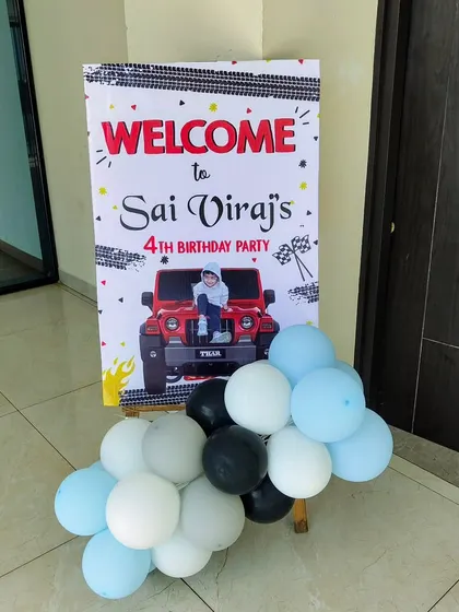 The welcome sign for the Thar themed party, decorated with balloons.
