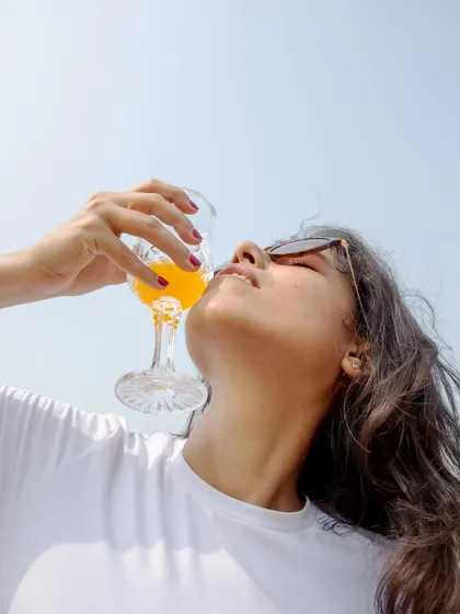 An artistic, low-angle shot creating a dramatic and refreshing summer mood.