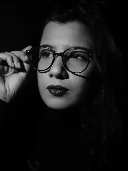 A black and white portrait from a low-key lighting experiment. Using shadows and minimal light, I aimed to create a sense of mystery and introspection.