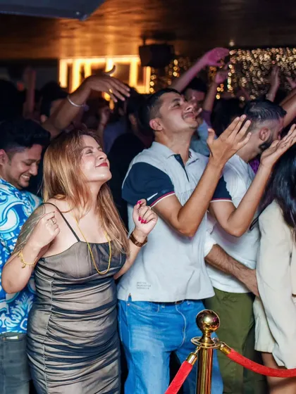 The crowd at Kaze with their hands in the air, united by the music.