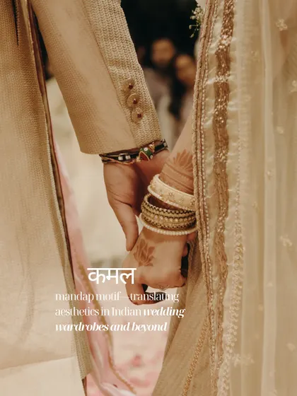 A close-up of the couple holding hands, the 'Kamal' or lotus motif subtly present in the bride's mehendi.