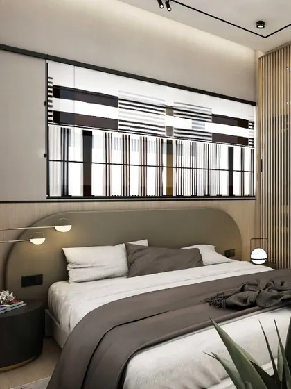 A bold, graphically striped window blind becomes the visual anchor in this bedroom. The design is complemented by a curved, muted gray headboard and warm wood slat details, creating a contemporary yet cozy retreat.
