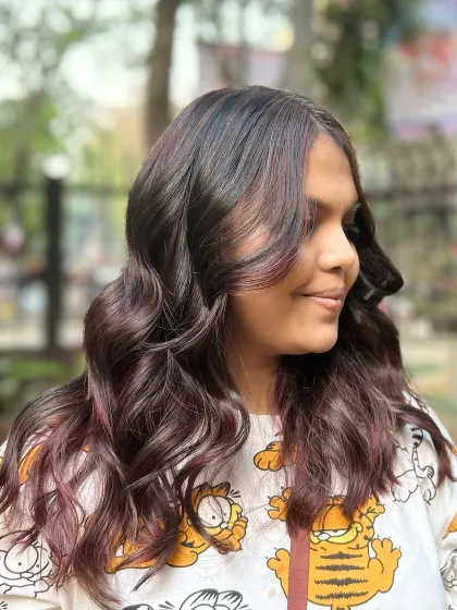 Our Cherry Choco balayage blend. This look combines deep chocolate tones with hints of cherry red for a subtle yet playful effect.