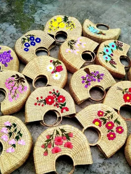 Our collection of handcrafted bags showcases the vibrant artistry of our local artisan partners. Made from natural kauna grass and adorned with colorful embroidery, these bags are perfect for retail, corporate gifting, or as a unique fashion accessory, with wholesale options available.