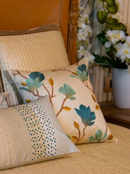 Perfect for adding a light and airy touch to your summer decor. This cushion, with its embroidered blue flowers on a neutral base, brings a touch of nature's beauty indoors.