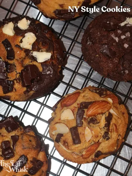 A tempting top-down view of our freshly baked NY-style cookies, including flavors like Vanilla Coffee, Nutella Sea-salt, and Almond Oats & Chocolate.