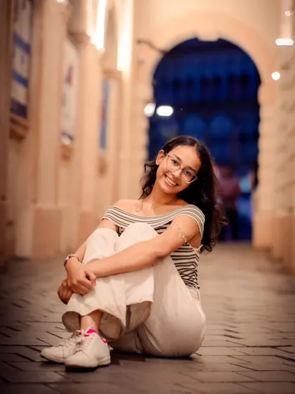 A seated portrait from the same alleyway shoot. Getting low to the ground provides a unique perspective and makes the subject the hero of the shot.