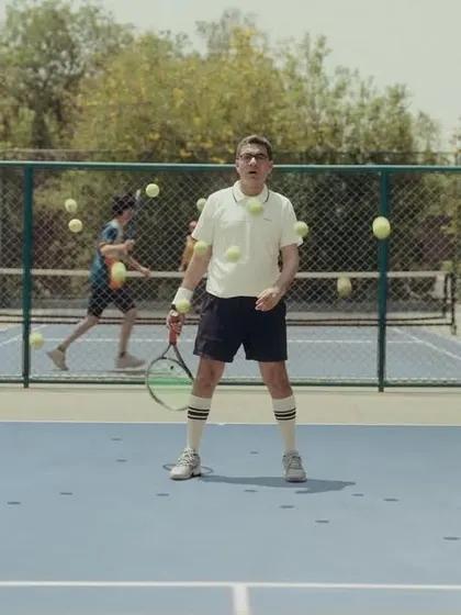 The tennis player character getting bombarded with balls, a visual metaphor for market noise. The retro sportswear adds to the quirky humor.