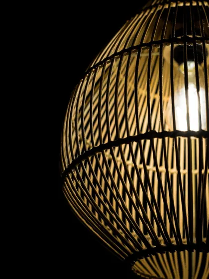 A macro view of the weave on the teardrop lamp. The interplay of vertical ribs and woven horizontal strands creates a pattern that is both strong and delicate.