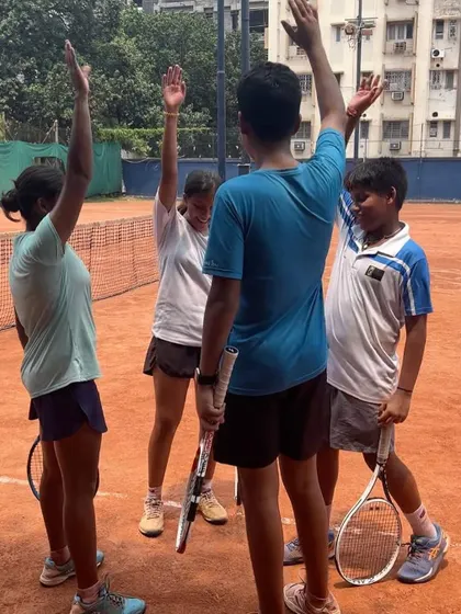 High fives and positive reinforcement are a big part of our coaching style. This moment from our Kolkata camp shows young athletes celebrating a point, building camaraderie and a love for the game.