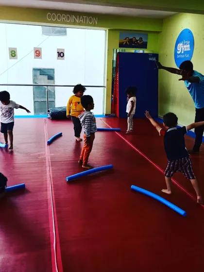 Our "Funny Bugs" class using softy sticks during their warm-up. This group activity is great for coordination and encourages kids to play and learn together.