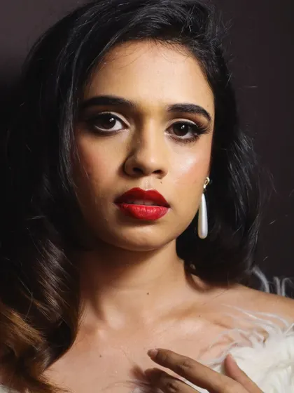 A classic 1950s Marilyn Monroe-inspired look I demonstrated at a makeup academy. It features the iconic winged liner, soft curls, and a bold red lip.