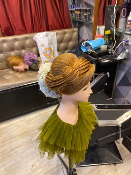 A different angle of the modern updo, showing its structure from the front. Learning to create styles that look great from all angles is a core part of my training.